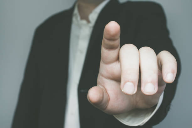 istock Man in suit with one finger up 687545828