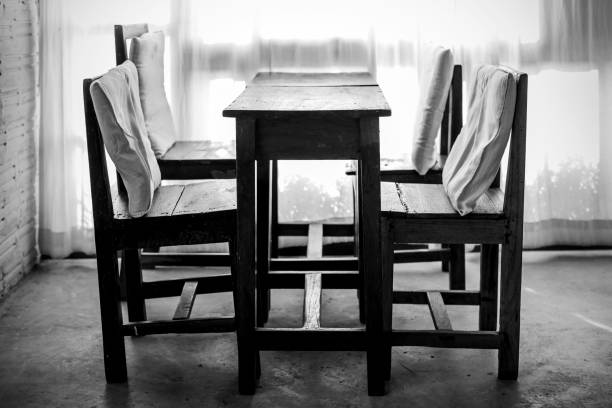 istock White room with wooden table and chair 687550260