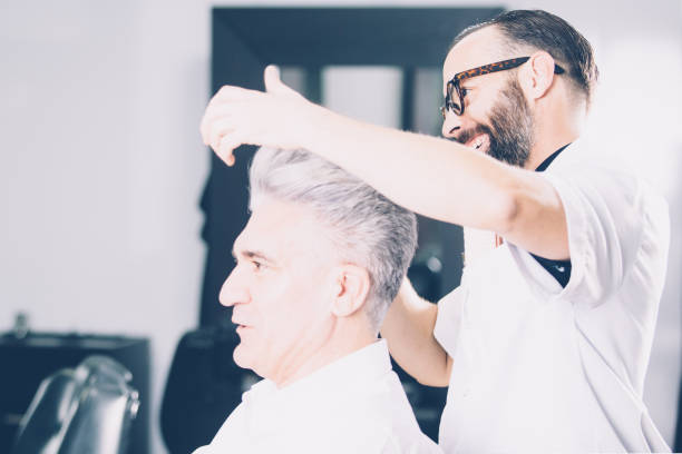 istock Expressive hairdresser at work 687552906