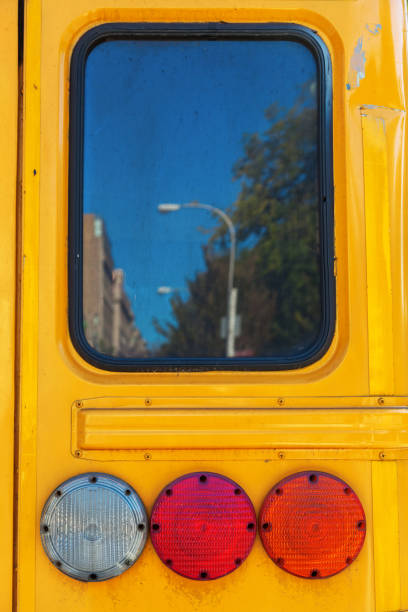 istock tail lights of a yellow school bus in NYC 687554356
