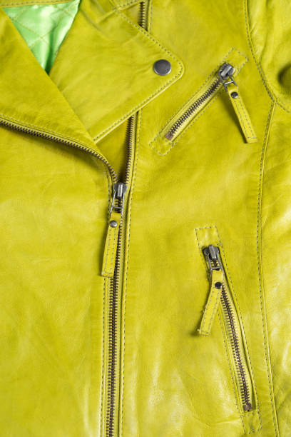 istock Green leather jacket. Leather jacket macro details. Jacket zippers and pockets 687559346