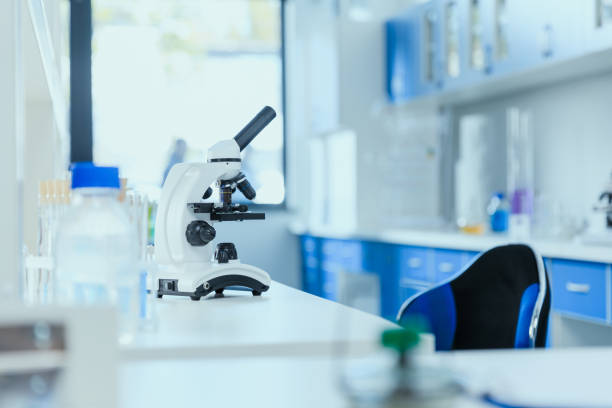 istock Microscope on table with laboratory equipment in chemical lab, clean room laboratory concept 687560296