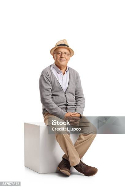 Senior Sitting On A Cube Stock Photo - Download Image Now - Sitting, Senior Adult, Cut Out