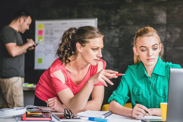istock Two woman having meeting and using laptop 687575978