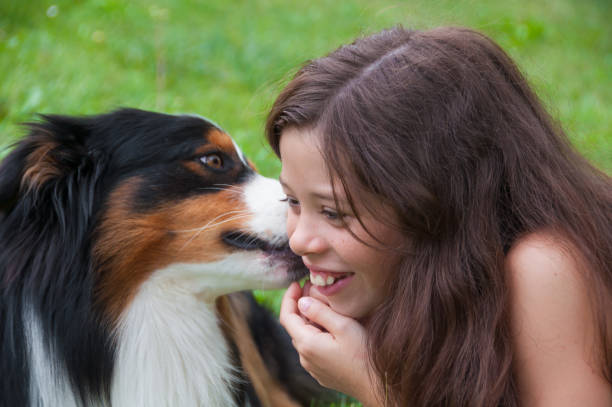 istock Smiling girl with her dog 687576994