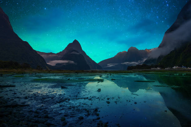 The Milford Sound fiord. Fiordland national park, New Zealand with milky way Famous Mitre Peak rising from the Milford Sound fiord. Fiordland national park, New Zealand with milky way fiordland national park photos stock pictures, royalty-free photos & images