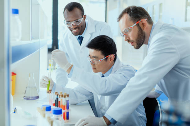 istock Professional scientists in white coats working together in chemical laboratory 687590914