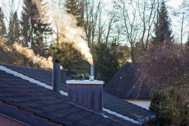 istock smoking chimney in sunny morning 687594064