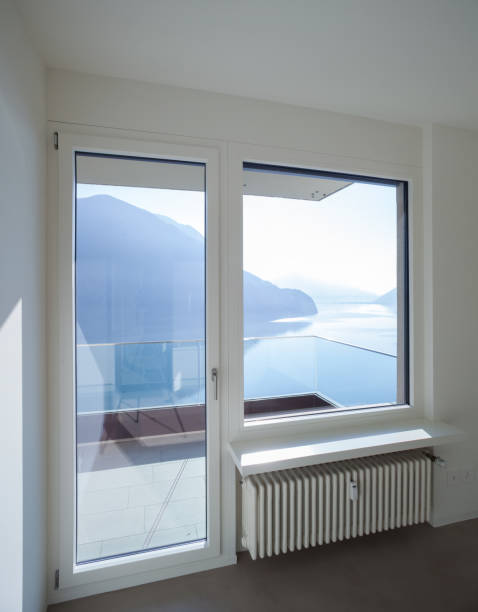 istock Empty room in modern house, lake view 687610850