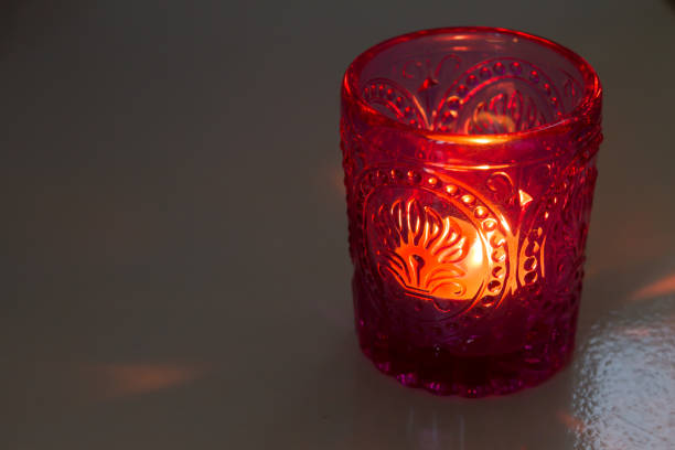 candle on a colorful fabric.