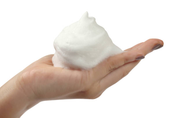 istock Hand of women the white foam bubble 687614000