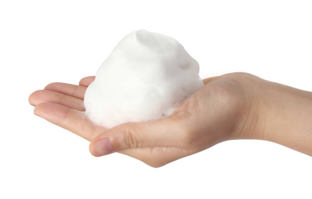 istock Hand of women the white foam bubble 687614782