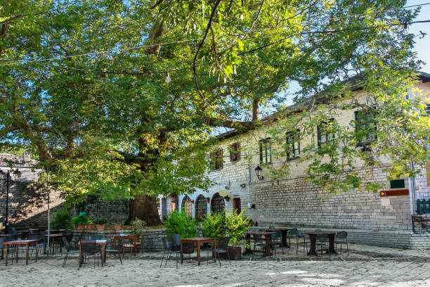 Monodendri village. Zagoria, Greece Main square in Monodendri, one of the stone villages of Zagoria. Epirus, Greece zagori stock pictures, royalty-free photos & images