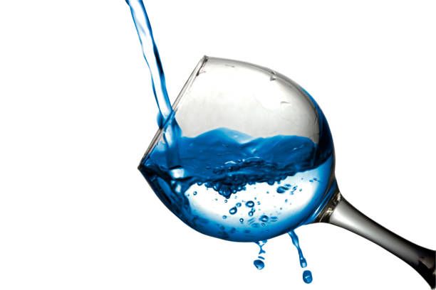 istock water pours into a glass on a white background 687624948