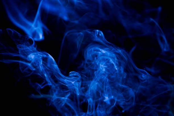 istock Blue toxic fumes movement on a black background. 687625326