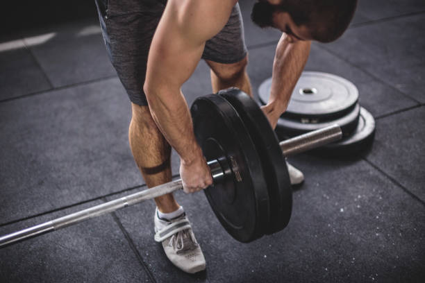 istock Picking up the weights at the gym 687635328