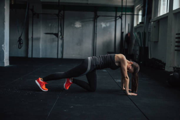 istock Pretty woman working out alone in the gym 687636388