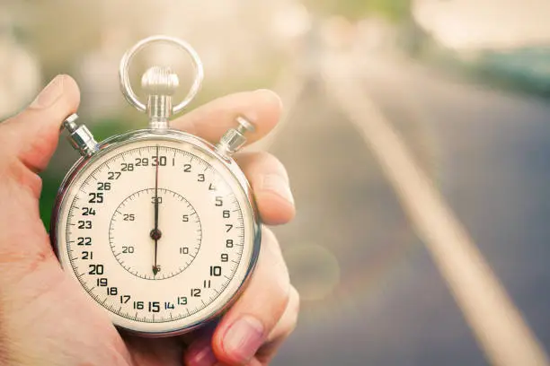 Old chronometer in young man hand ready to start