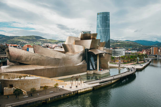 Guggenheim Museum, Bilbao Bilbao, Spain - 15th April 2016. The Guggenheim museum building in Bilbao, Spain. It was designed by Frank Ghery and it's become a symbol of Bilbao, the largest city in the Basque Country. frank gehry building stock pictures, royalty-free photos & images