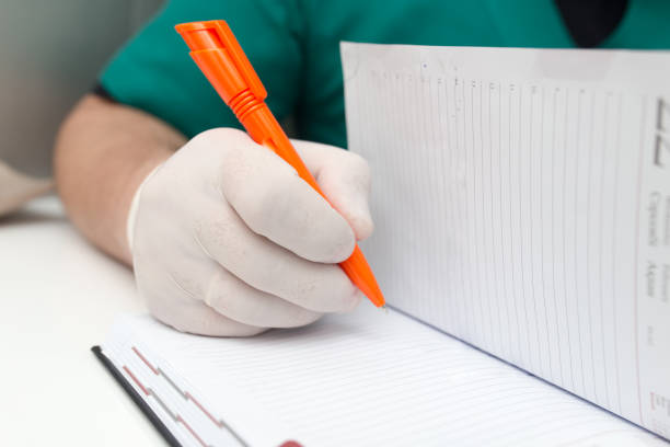 istock The doctor writes in a notebook at the clinic 687650312