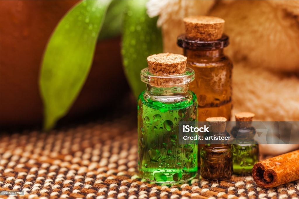 Natural. Bottles with organic essential aroma oils on background Aromatherapy Stock Photo