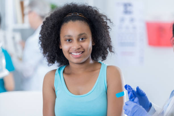 istock Teenage girl receives immunization 687662988