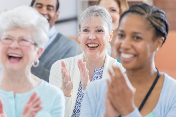 istock Diverse group of people applaud during seminar 687663114