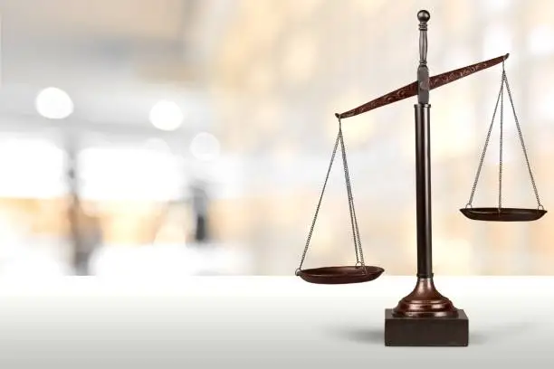 Law scales on table background. Symbol of justice