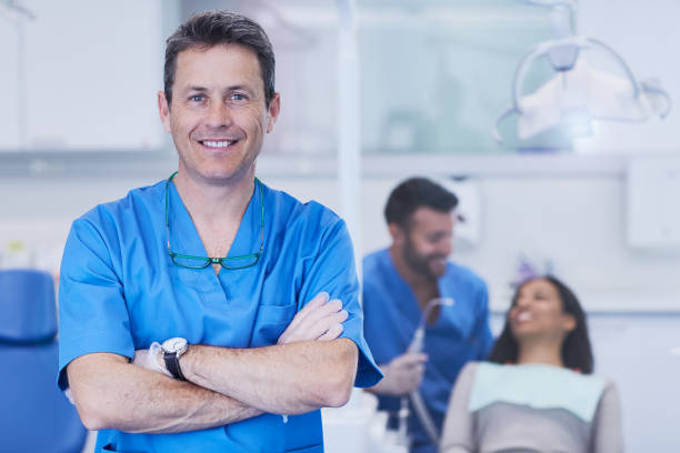 istock Dental doctors in a dentist's office. Portrait looking at camera. 687663692