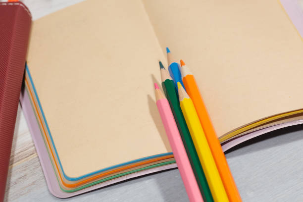 istock several different color pencils on the empty page of notebook copy space 687664516
