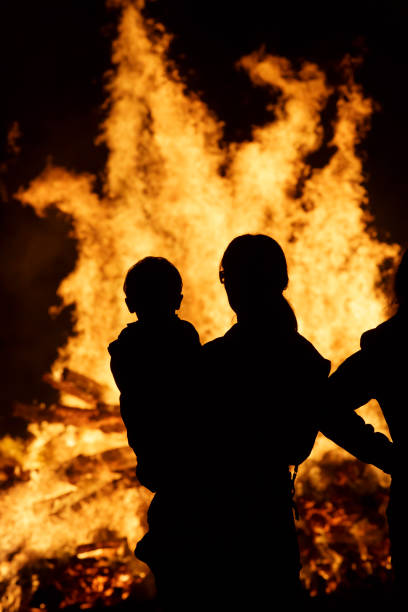Silhuettes on bonfire night stock photo