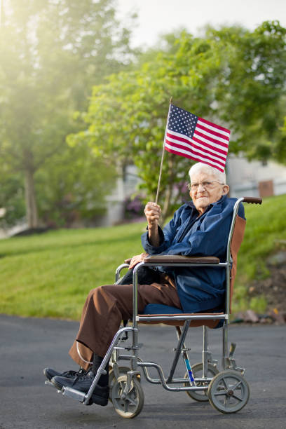 istock Proud Senior Man Holding US Flag 687674892