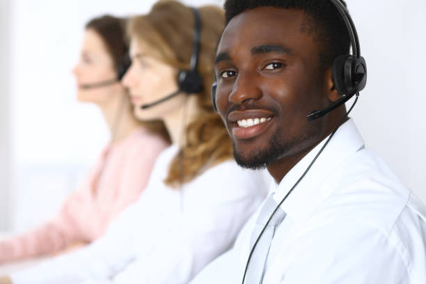 istock Call center operators. African american businessman in headset. 687678382