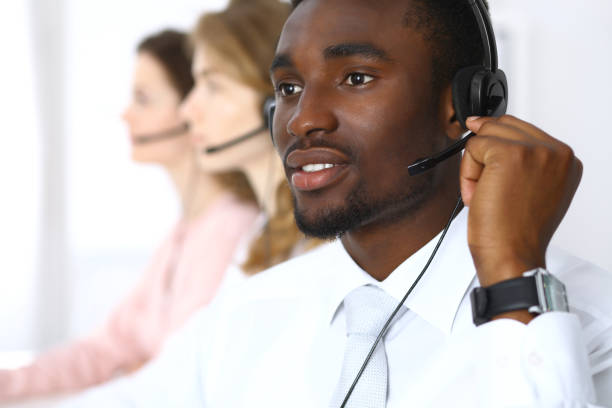 istock Call center operators. African american businessman in headset. 687678486