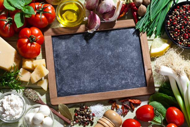 istock Chalkboard with fresh ingredients for cooking and seasoning 687679144