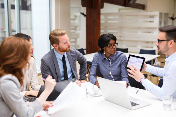 istock Business people analyzing financial chart with a financial analyst 687685074