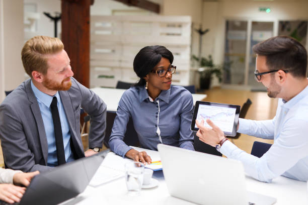 istock Business people analyzing financial chart with a financial analyst 687685378