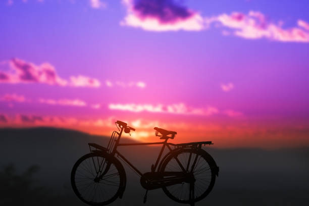 istock silhouette of bicycle with blurred background sunset 687685808