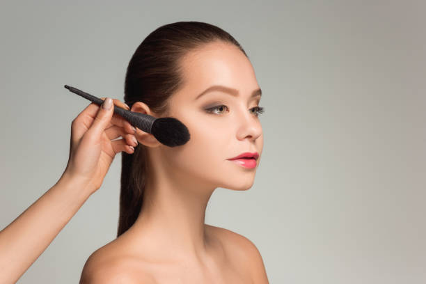 istock Beautiful female eyes with make-up and brush 687686142