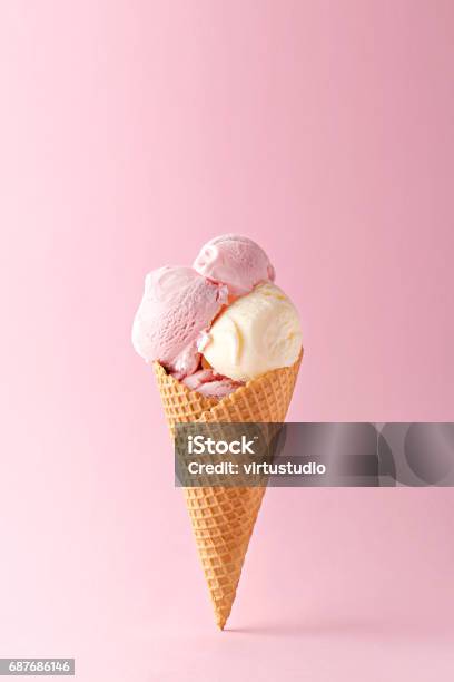 Ice Cream Cone Vanilla And Strawberry Flavors On A Pink Background Copy Space Stock Photo - Download Image Now
