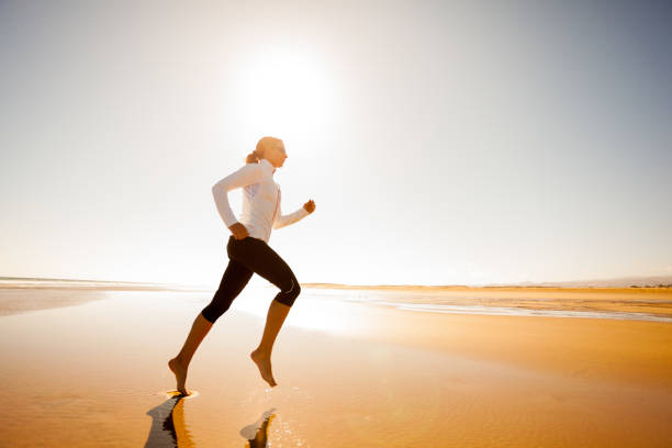 istock Women in Sport, beach jogging 687686540
