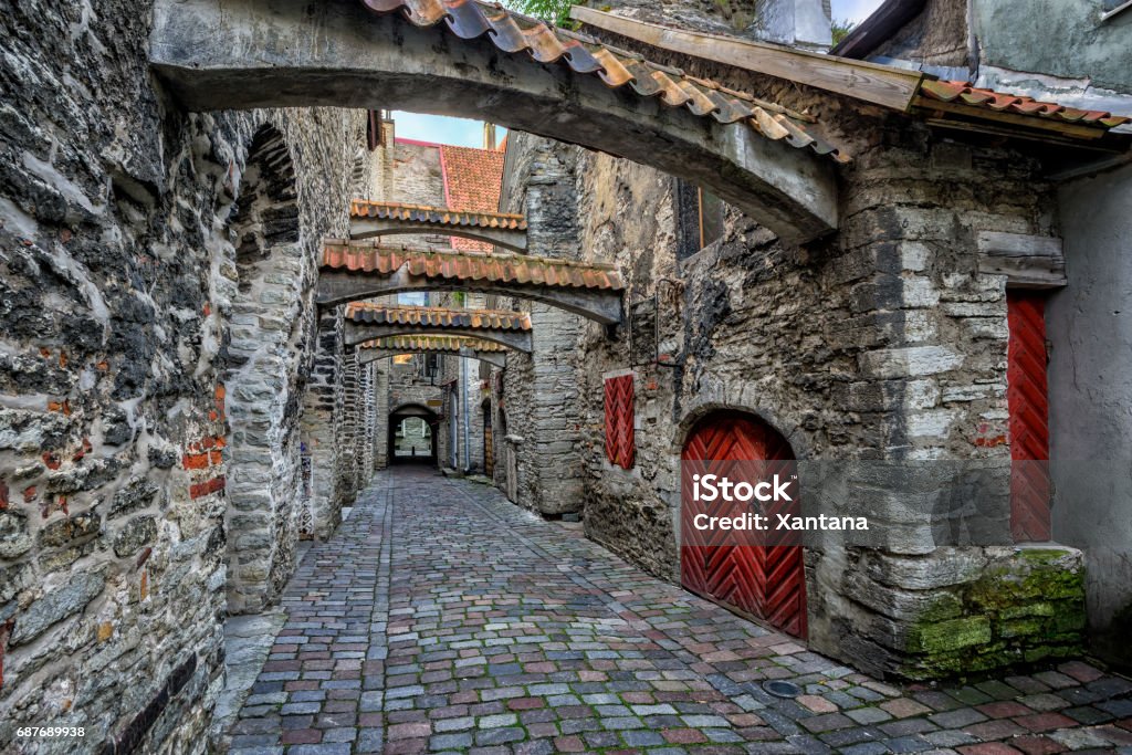Old cobbled street in old town of Tallinn, Estonia The St Catherine's Passage is historical cobbled street in the old town of Tallinn, Estonia Tallinn Stock Photo