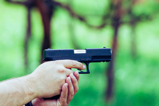 istock A gun in his hand. Training. Shooting at targets 687690622