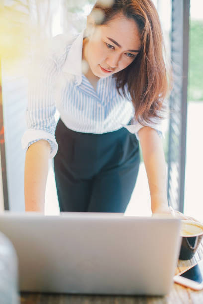 istock business asian woman working with laptop computer. 687695098