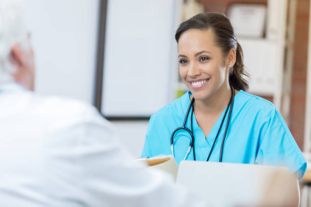 istock Confident nurse interviews for hospital position 687695628