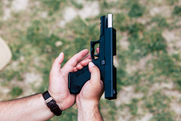 istock Recharge the gun in hand. Training on shooting 687695824