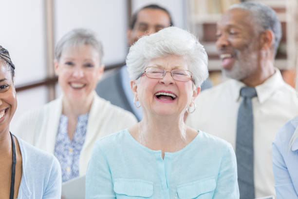 istock Beautiful senior woman laughs during seminar 687698416