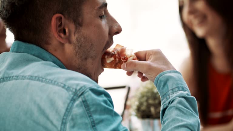 Man eating meat bruschettas in a restaurant