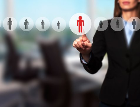 Businesswomen Hand select New Employee from Electronic interface using for Business technology, internet, networking, Recruitment and Workforce Concept. Isolated on office. Stock Image