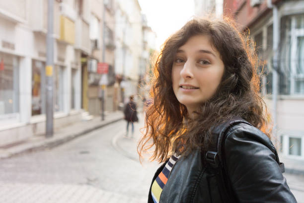 istock Woman posing on the street in sunset 687715444